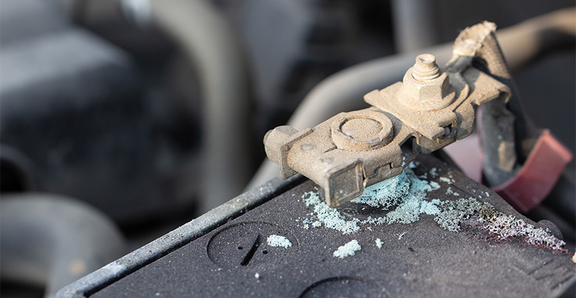 Battery with corrosion on one of the terminals