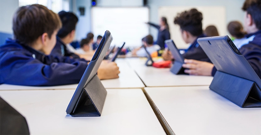 group of kids on tablets