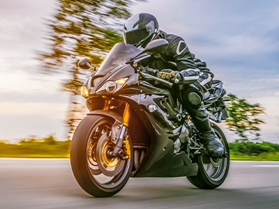 Motorcyclist riding on the road