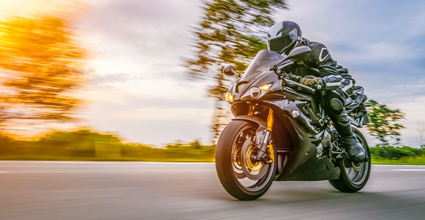 Motorcyclist riding on the road