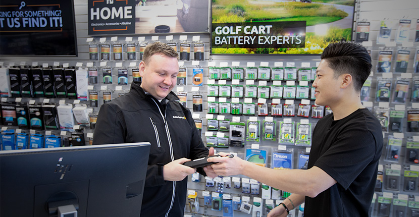 employee talking to a customer about recycling