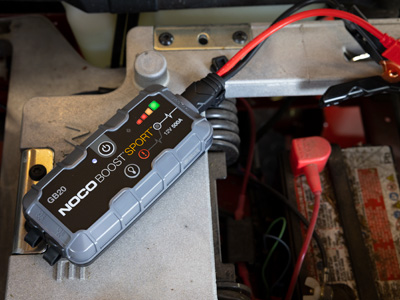 Using a charger to charge a lawn mower battery