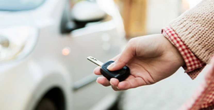A person trying to use their key fob