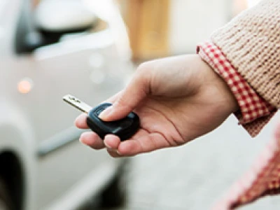 A person trying to use their key fob