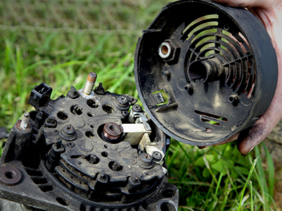 Opening an alternator on the grass