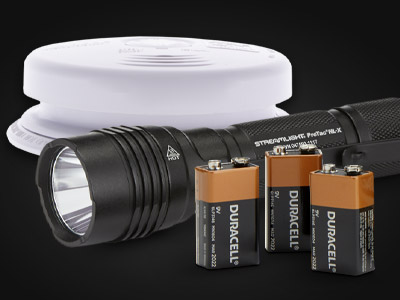 fire alarm, flashlight, and three 9V Duracell batteries