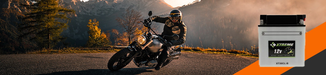 A person driving a motorcycle on road in mountainous forest, Flooded battery hero