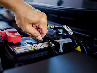 Checking the fluid levels of a flooded auto battery