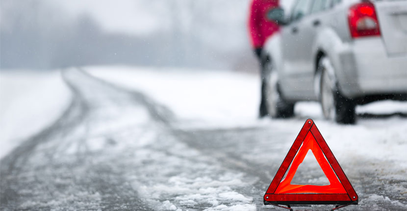 white car on side of the road in winter