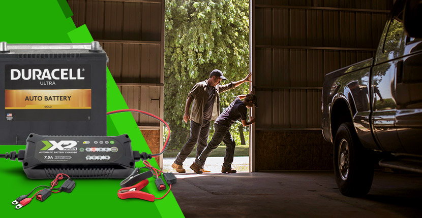 Opening a barn door with a truck inside, hero of a auto battery and charger