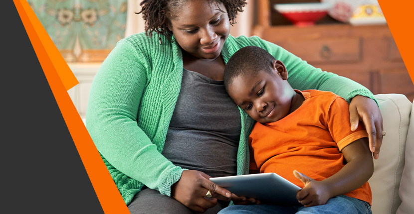 A mom and her son on a tablet together