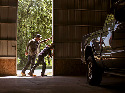 Opening a barn door with a truck inside