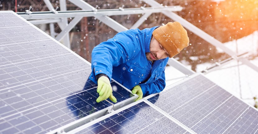 installing solar panels in the snow