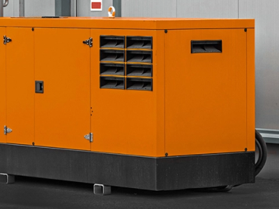 Large orange generator in a warehouse